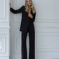 A black suit with a straight jacket and wide trousers