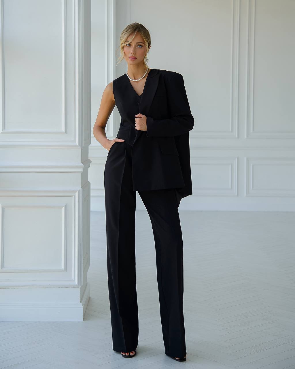 Black three-piece suit with vest