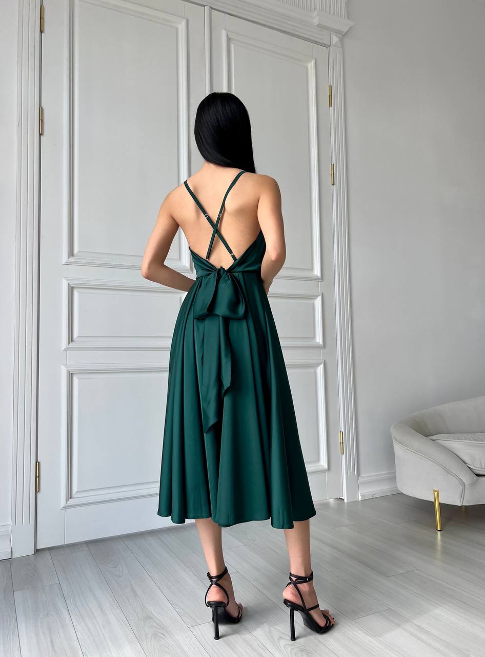 An emerald dress with an open back and a lush skirt