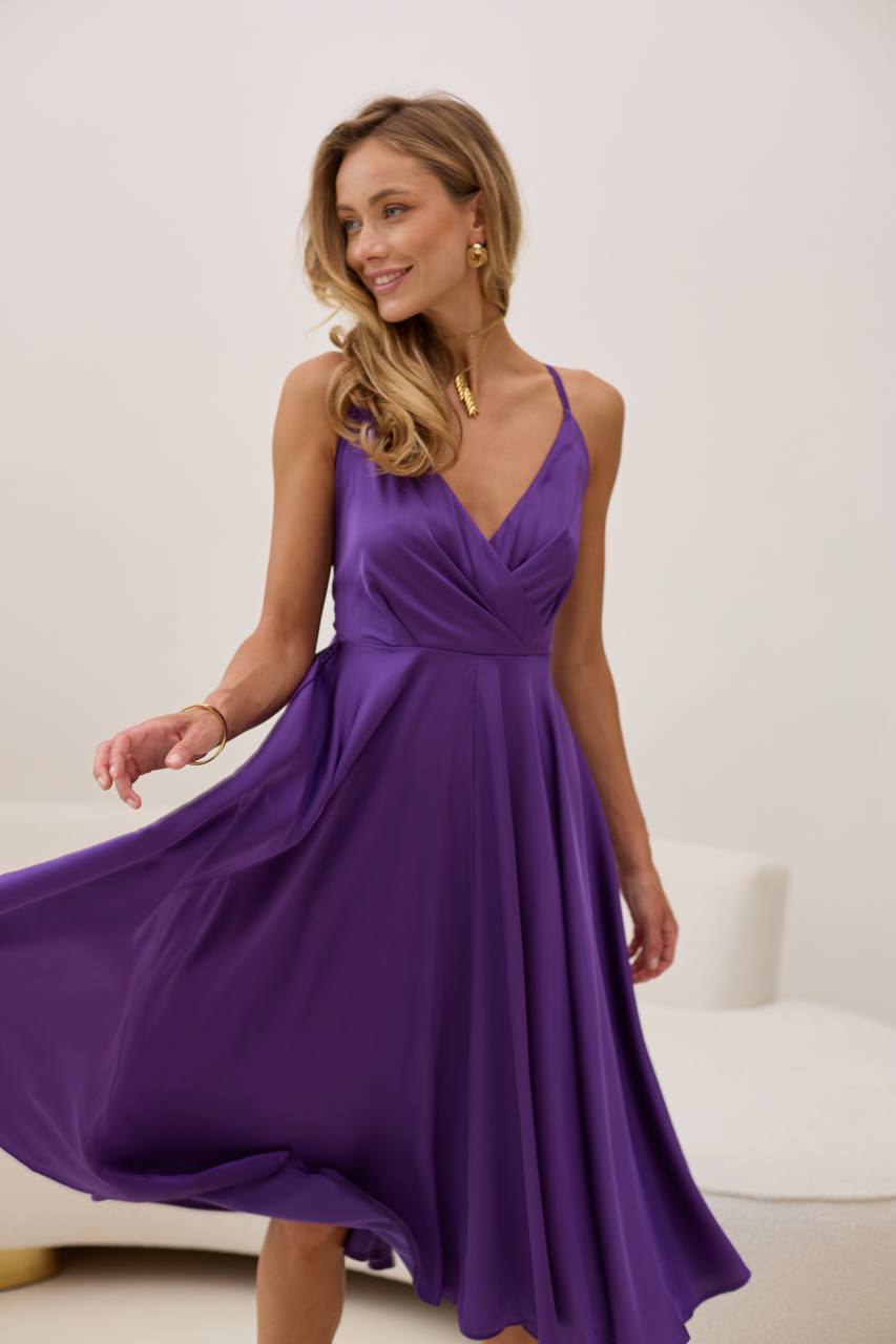 Plum dress with an open back and a lush skirt