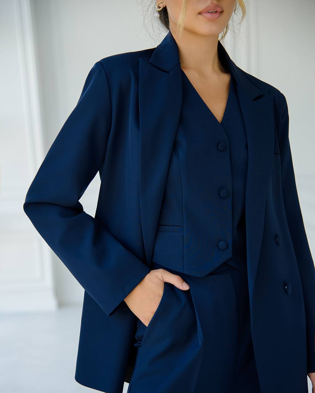 Dark blue three-piece suit with vest