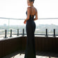 Black dress combination with an open back 