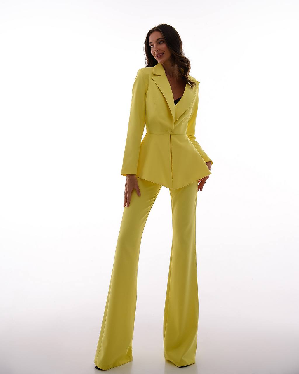 A yellow suit with a peplum jacket and flared pants