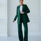 A green suit with a straight jacket and wide trousers 