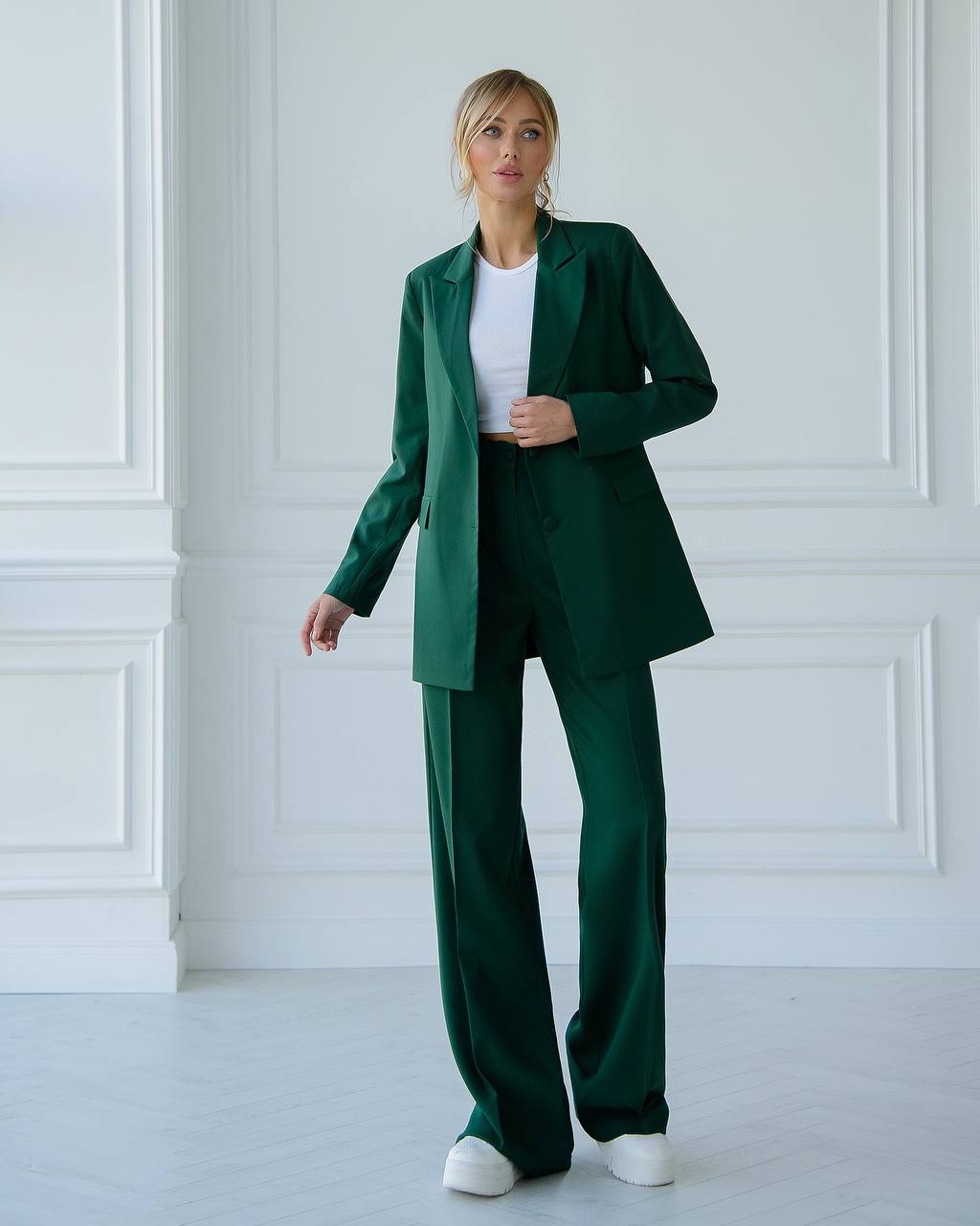 A green suit with a straight jacket and wide trousers 