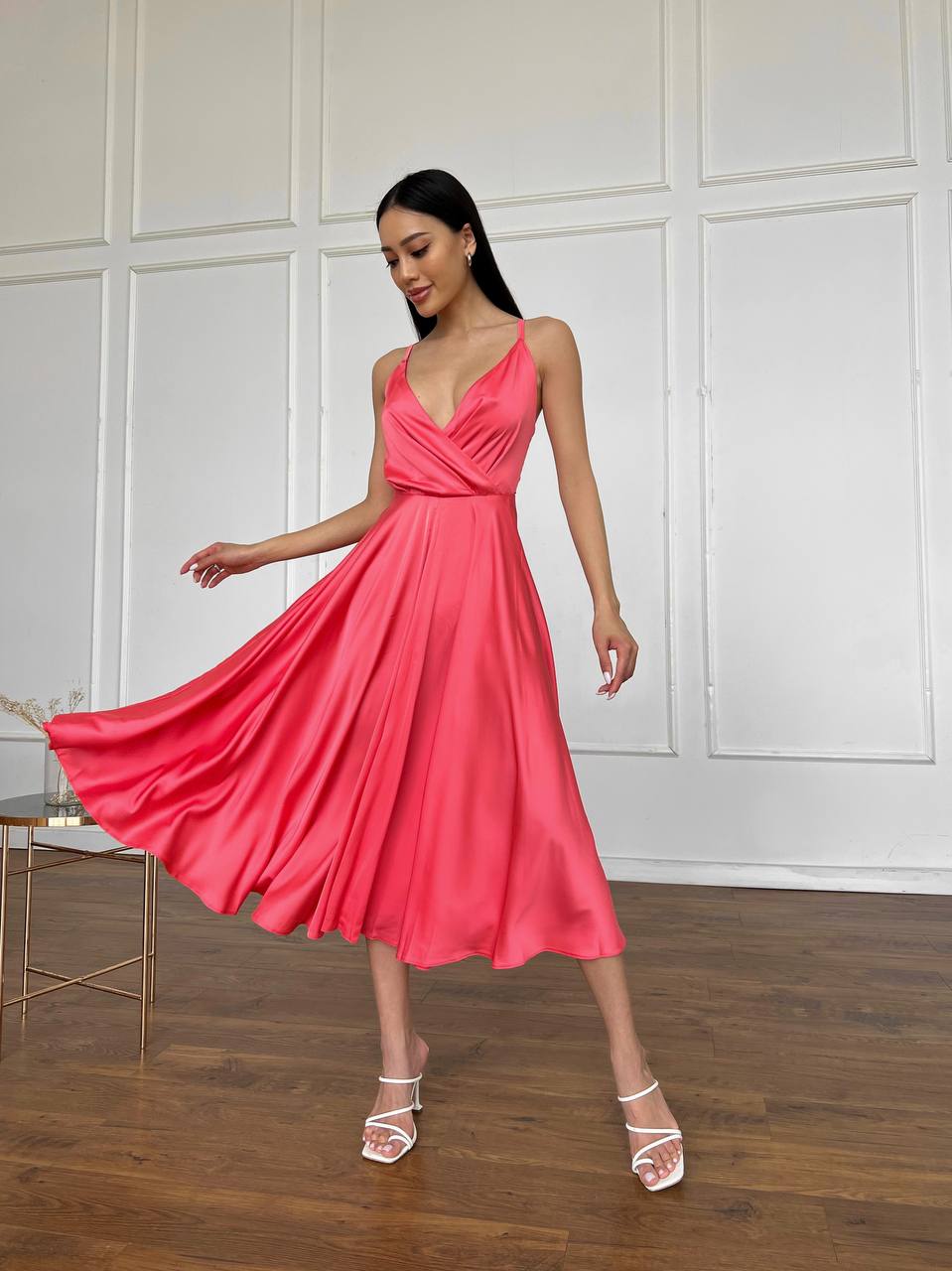 Coral dress with an open back and a lush skirt