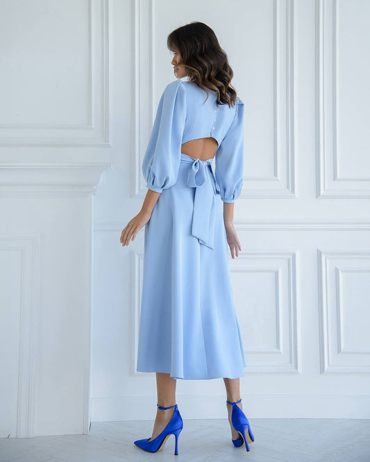 Blue midi dress with a full skirt and a bow