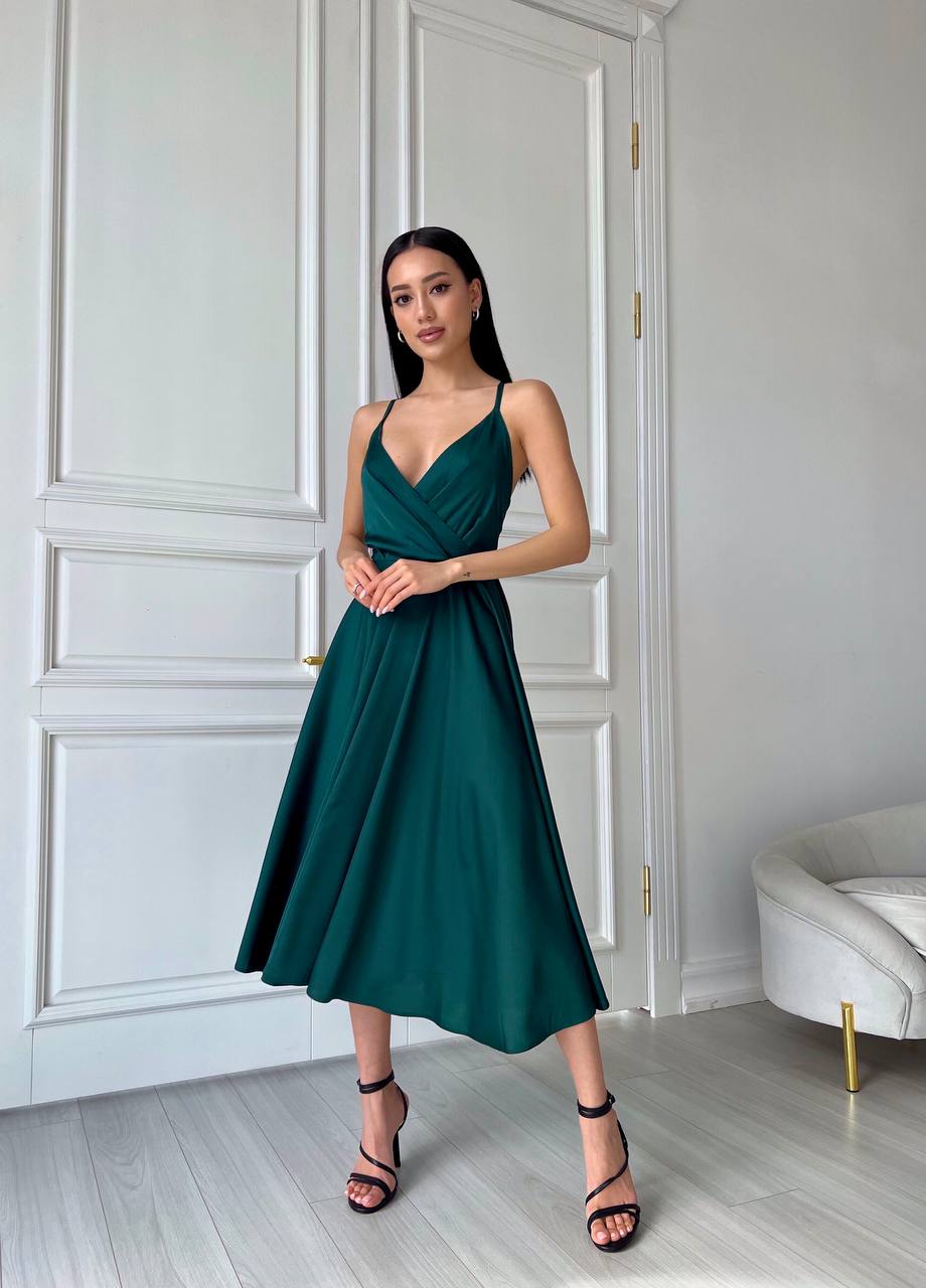 An emerald dress with an open back and a lush skirt