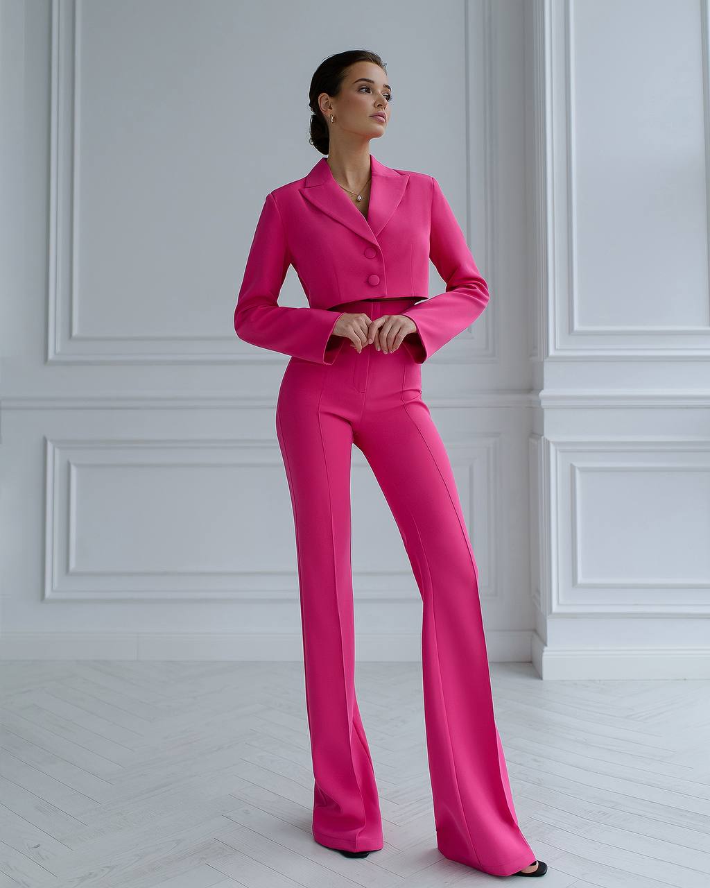 A crimson suit with a crop jacket and flared pants