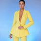 A yellow suit with a peplum jacket and flared pants