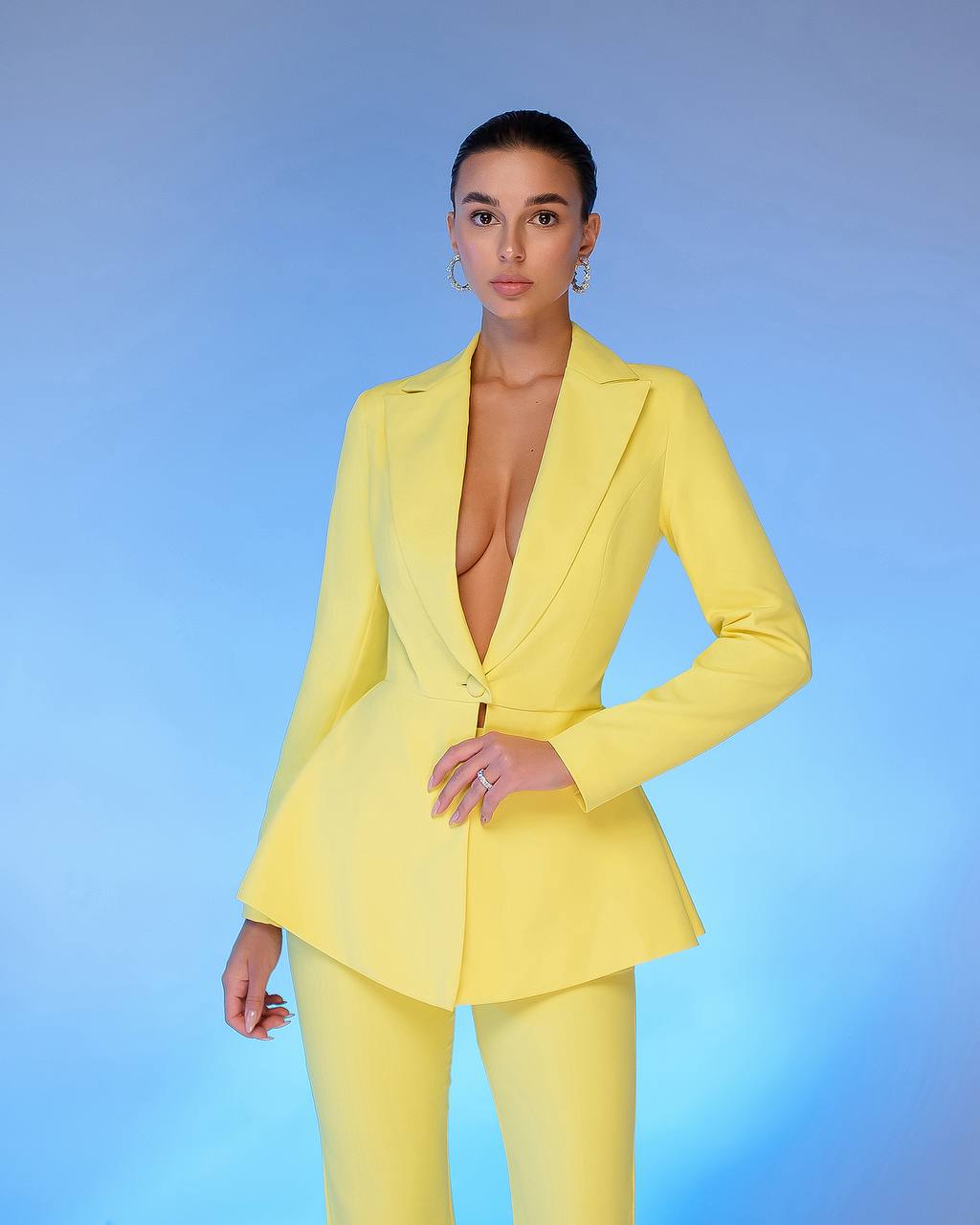 A yellow suit with a peplum jacket and flared pants