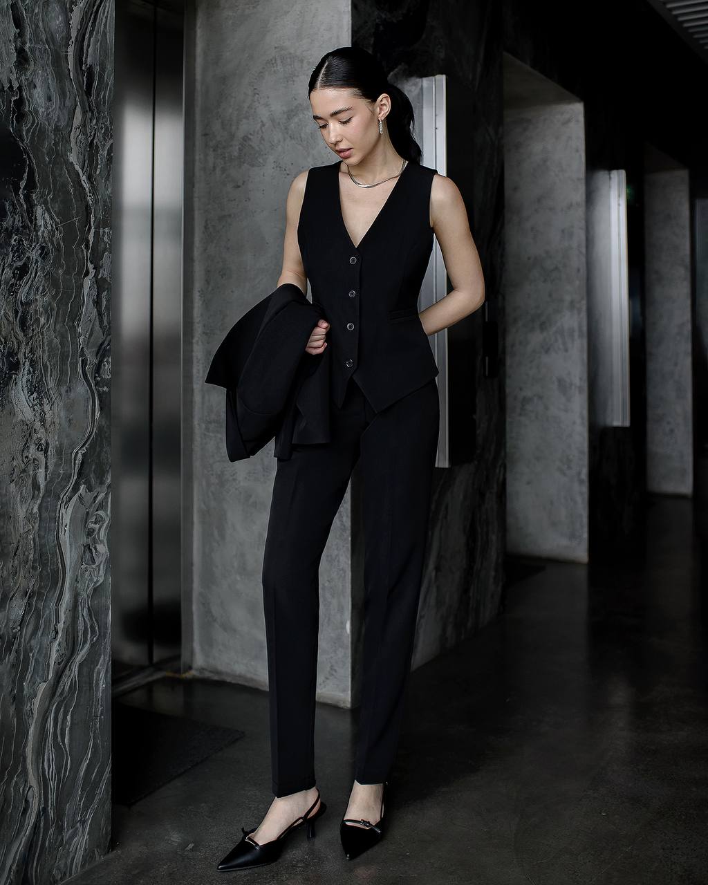 Black three-piece suit with vest