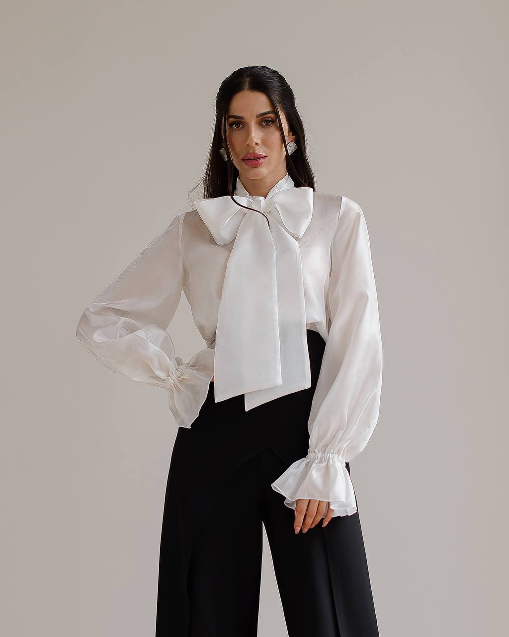 Milk transparent blouse with a bow