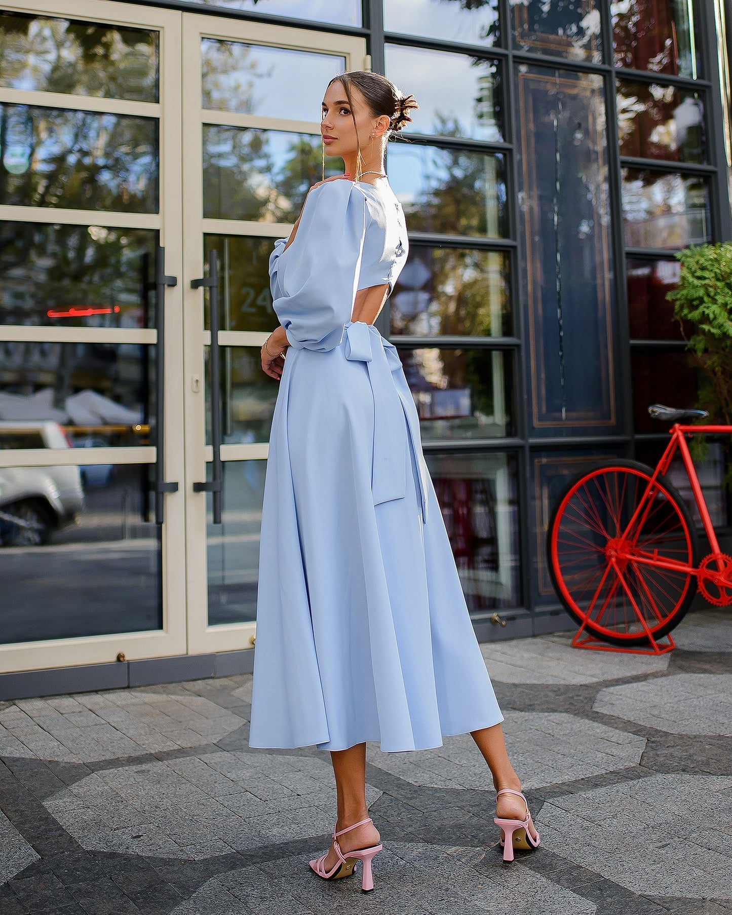 Blue midi dress with a full skirt and a bow