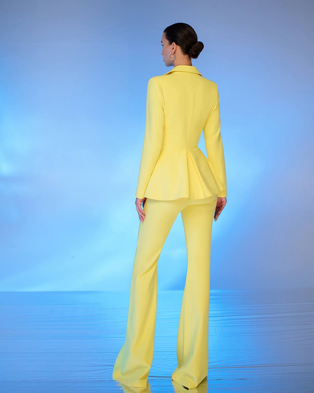 A yellow suit with a peplum jacket and flared pants