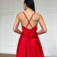 Red dress with an open back and a lush skirt