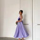 Lavender dress with an open back and a lush skirt