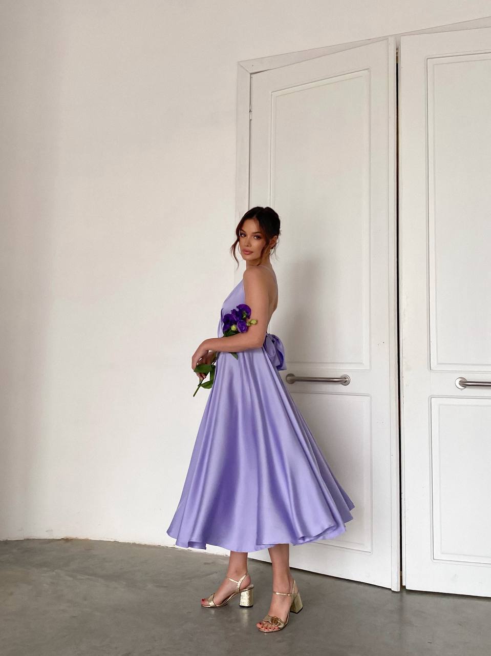 Lavender dress with an open back and a lush skirt