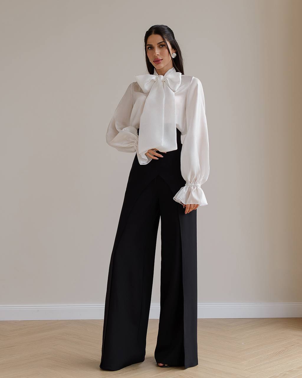 Black palazzo pants with a corset belt