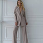 A beige suit with a straight jacket and wide trousers