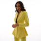 A yellow suit with a peplum jacket and flared pants