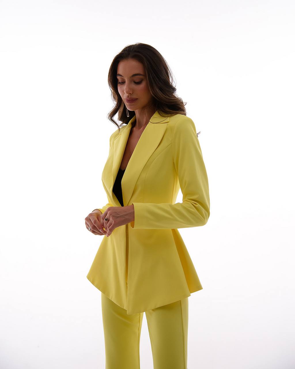 A yellow suit with a peplum jacket and flared pants