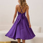 Plum dress with an open back and a lush skirt