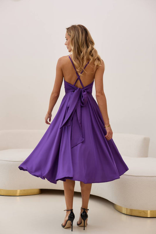 Plum dress with an open back and a lush skirt