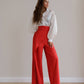 Red palazzo pants with a corset belt