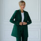 A green suit with a straight jacket and wide trousers 