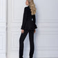 A black suit with a peplum jacket and tapered pants