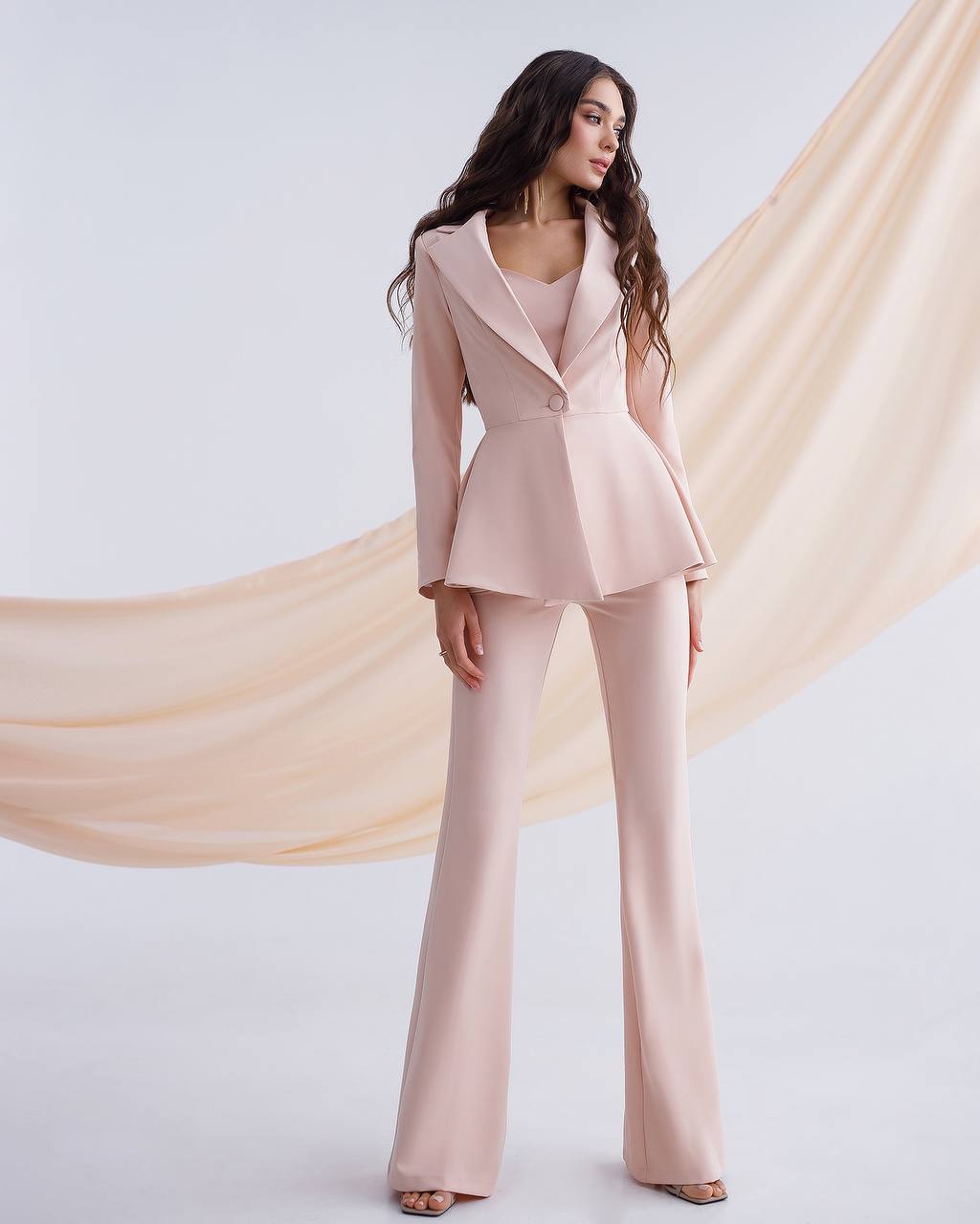 Beige suit with a peplum jacket and flared pants