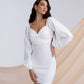 White mini dress with voluminous sleeves