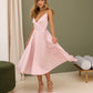 Soft pink dress with an open back and a lush skirt