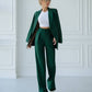 A green suit with a straight jacket and wide trousers 