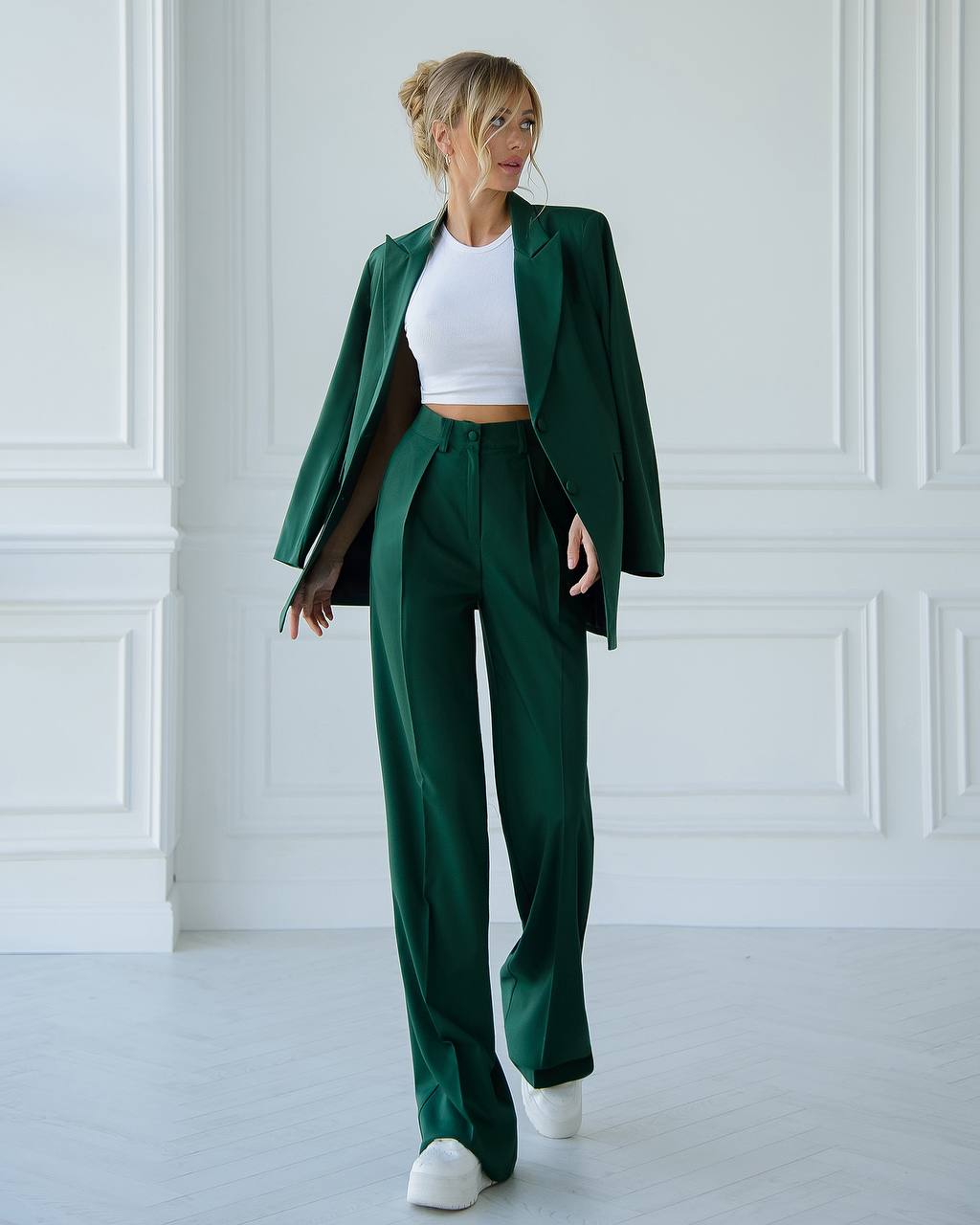 A green suit with a straight jacket and wide trousers 