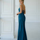 Dress-combination with an open back 