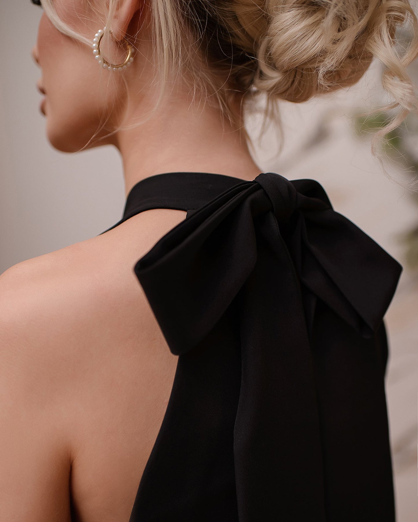 Black mini dress with a bow 