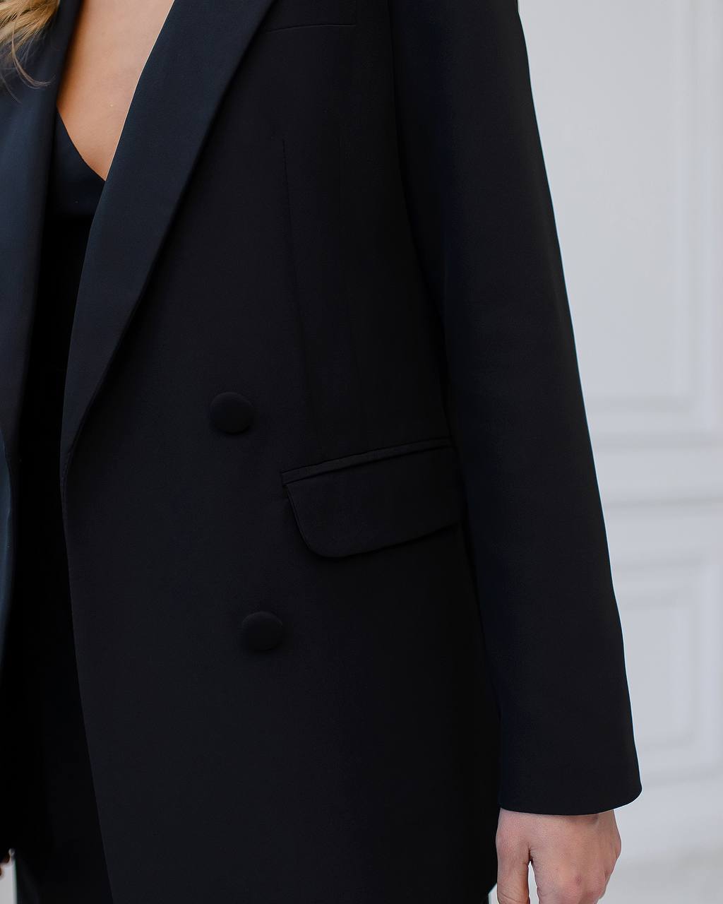 Black three-piece suit with a top