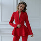 A red suit with a peplum jacket and tapered trousers