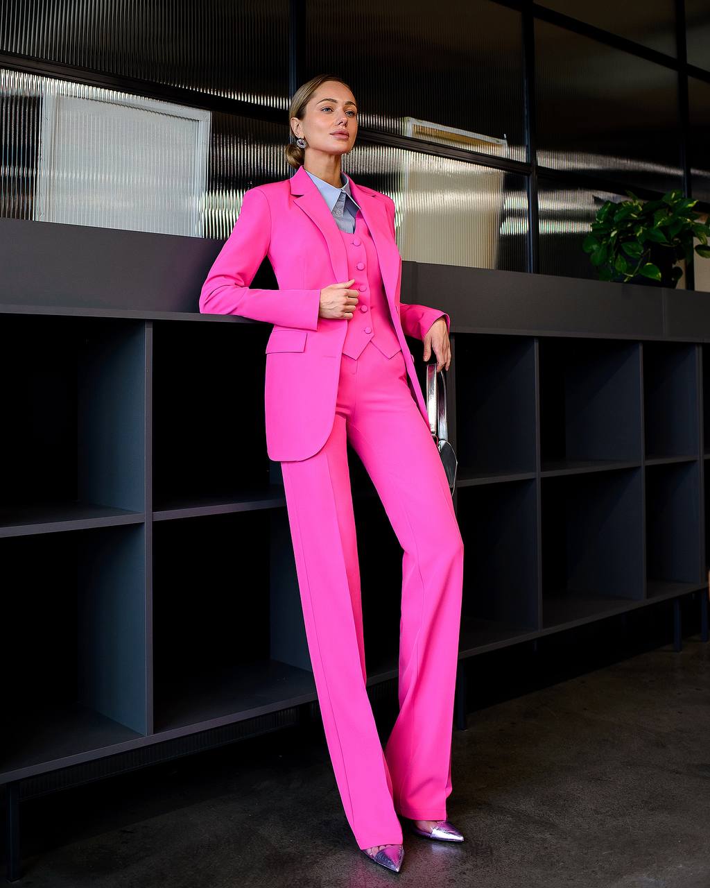 A crimson three-piece suit with a waistcoat and straight trousers