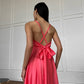 Coral dress with an open back and a lush skirt