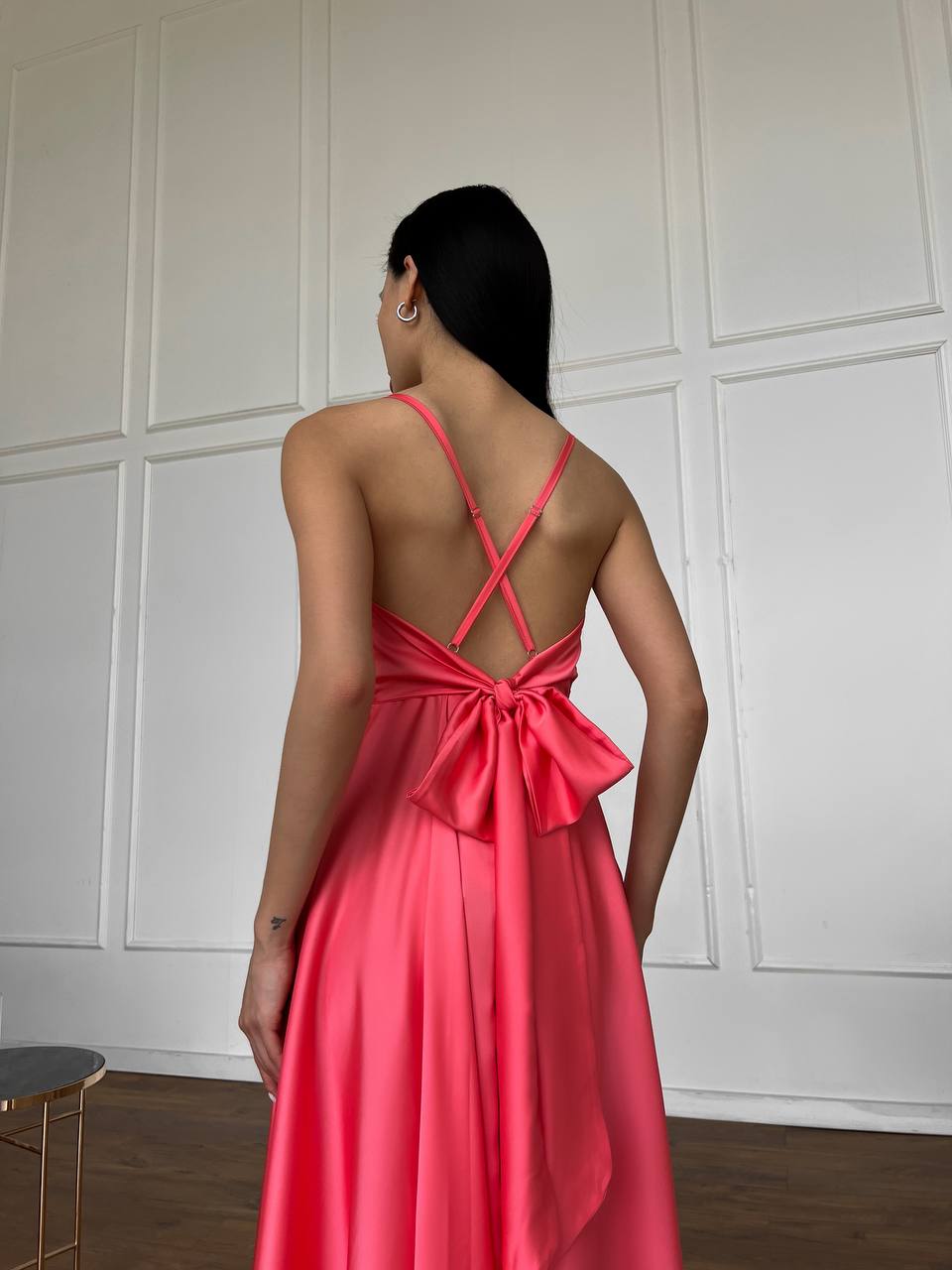 Coral dress with an open back and a lush skirt