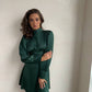 Emerald mini dress with open back and bow