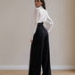 Black palazzo pants with a corset belt