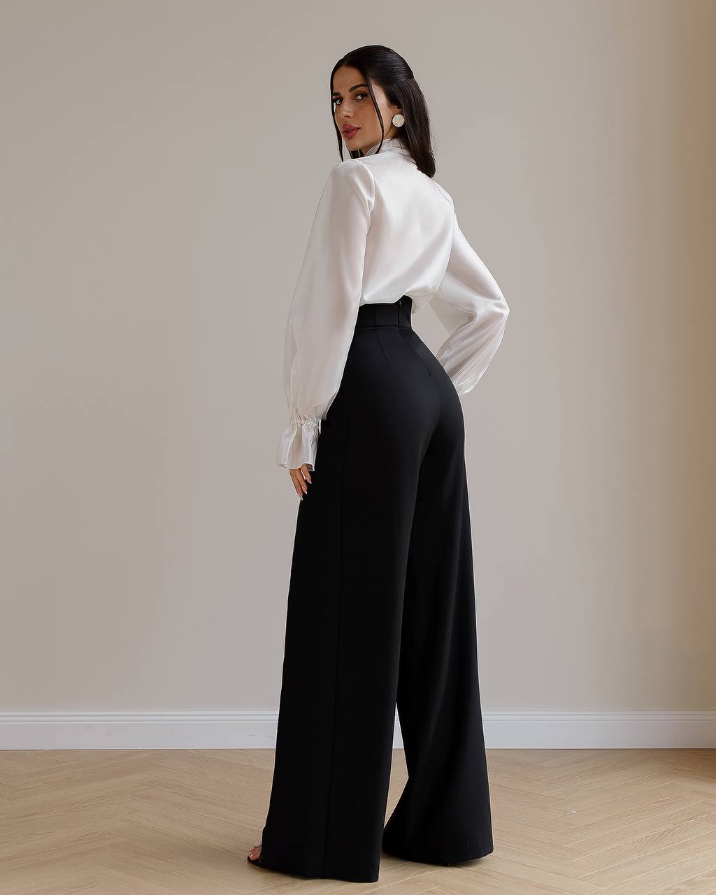 Black palazzo pants with a corset belt