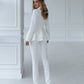 Milk suit with a peplum jacket and tapered trousers