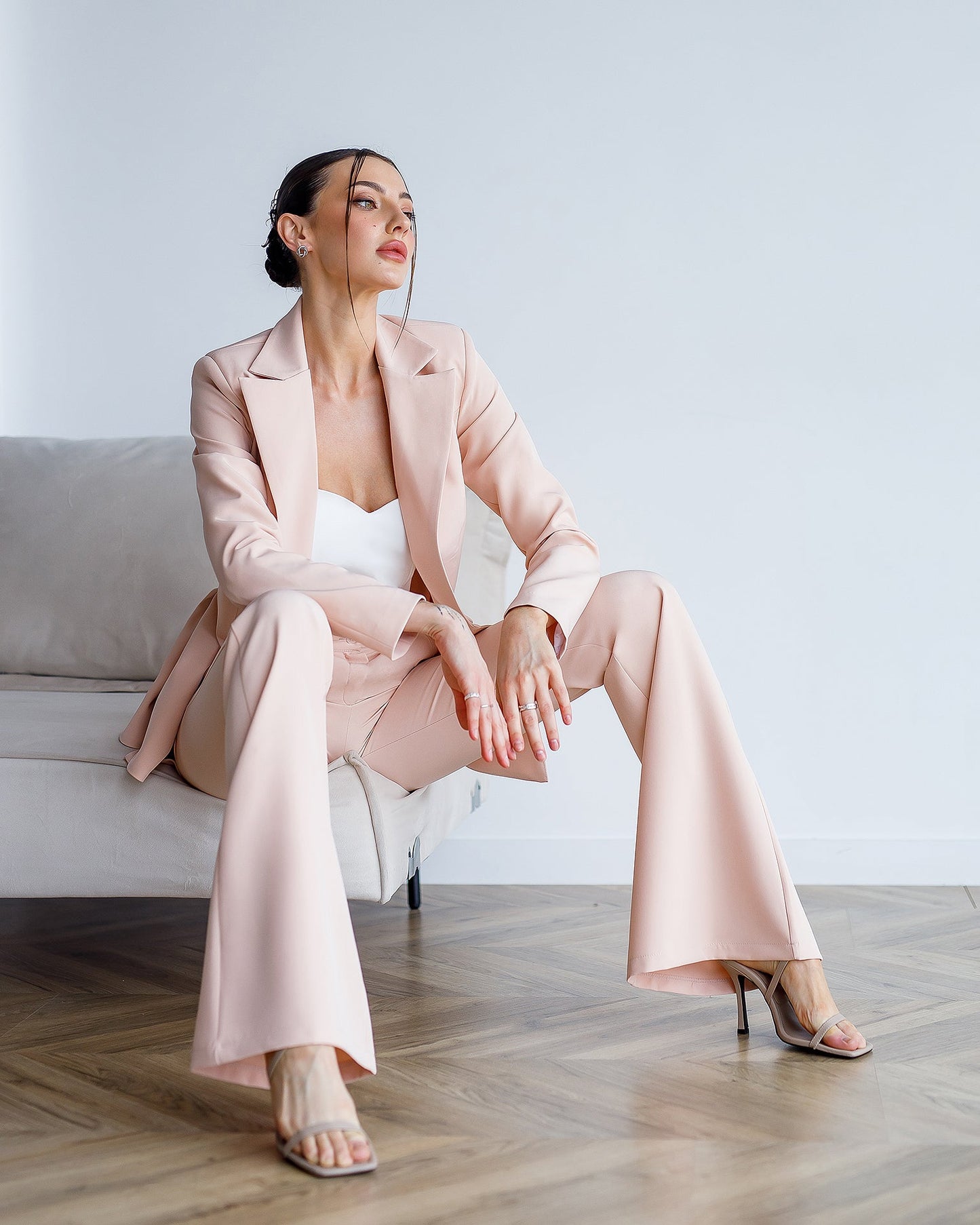 Beige suit with a peplum jacket and flared pants