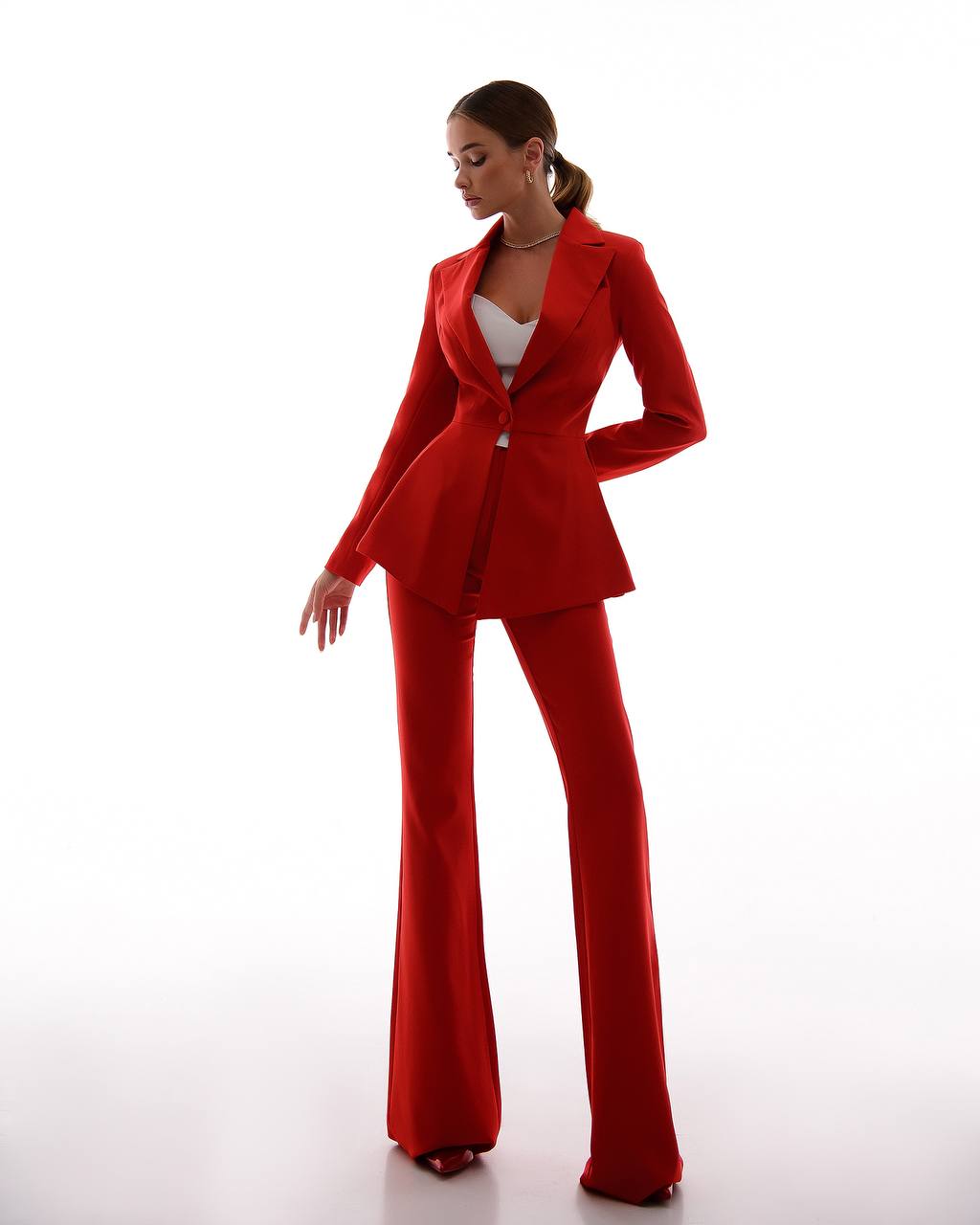 A red suit with a peplum jacket and flared pants