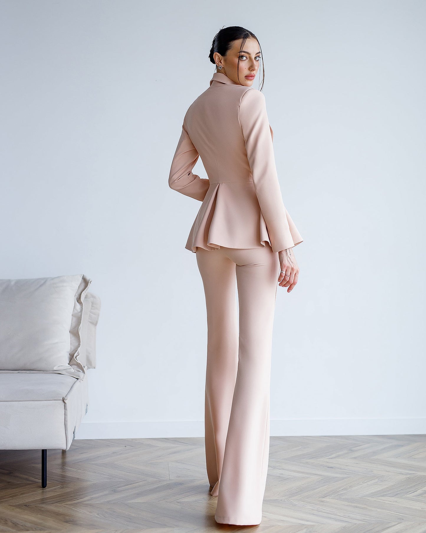 Beige suit with a peplum jacket and flared pants